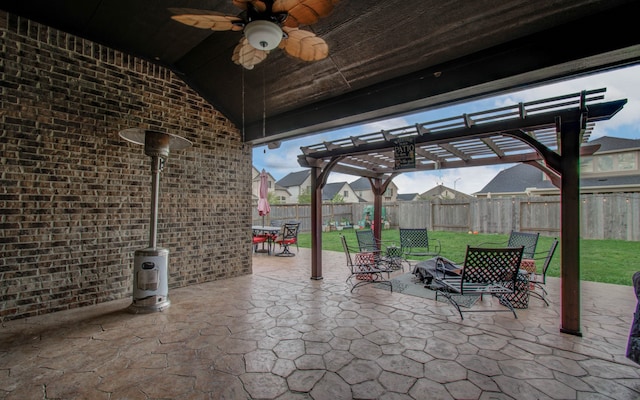 view of patio featuring ceiling fan and a pergola