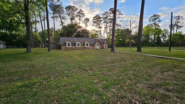 view of front of home with a yard