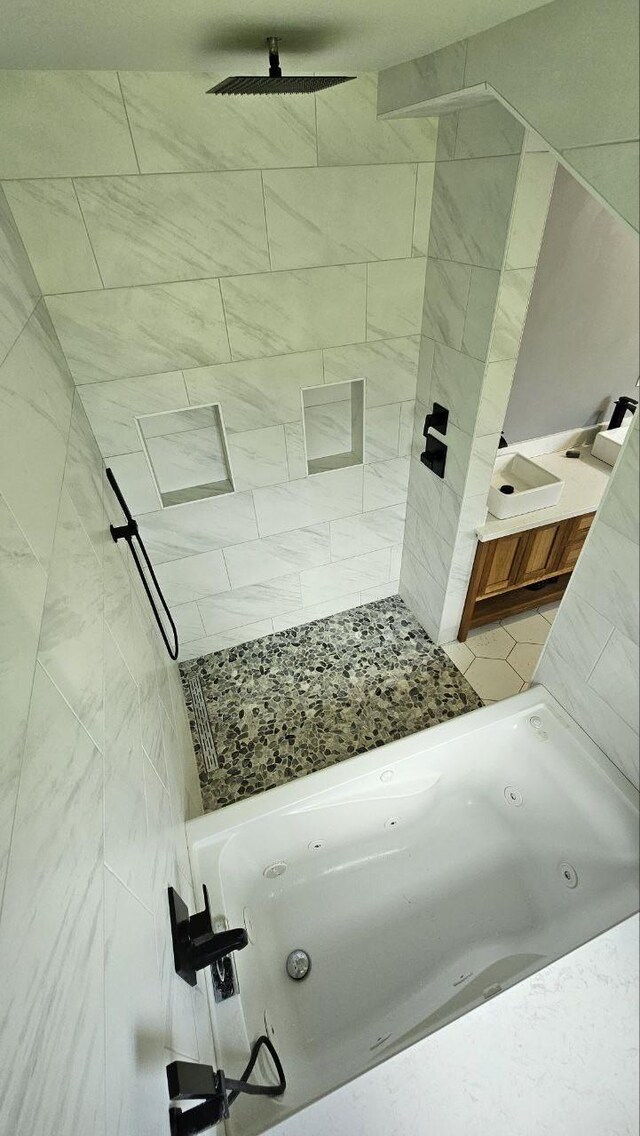 bathroom with a tile shower