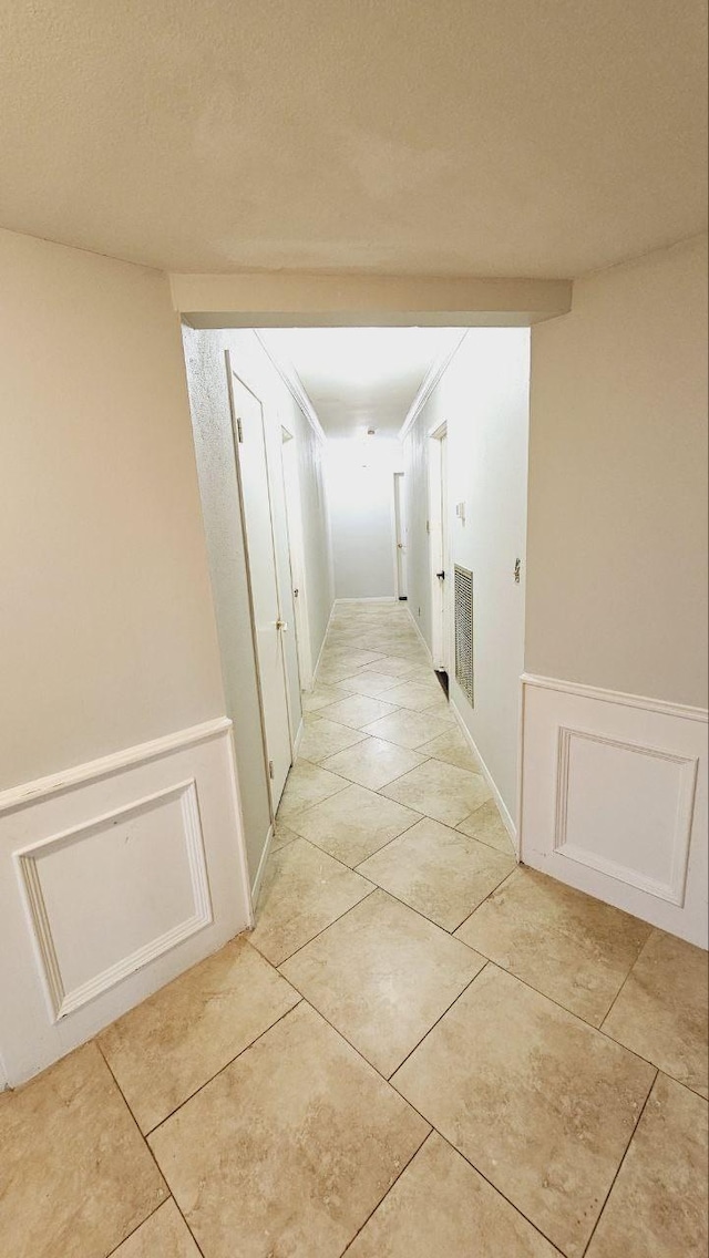 hallway with light tile patterned flooring