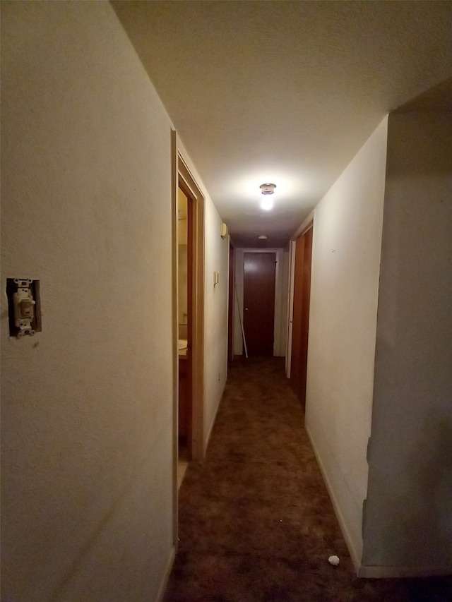 corridor with dark carpet