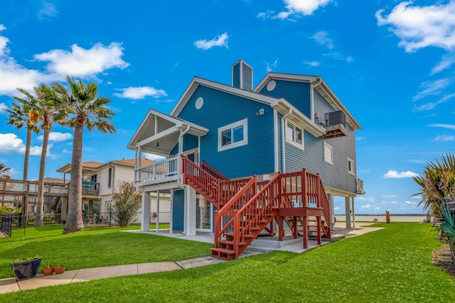 exterior space with a wooden deck, a patio, and a front lawn