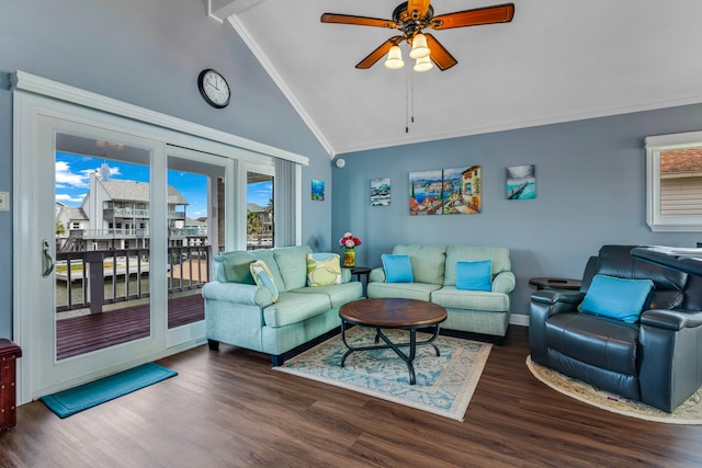 living room with crown molding, dark hardwood / wood-style floors, ceiling fan, and high vaulted ceiling