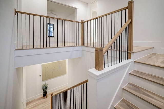 stairway featuring hardwood / wood-style flooring