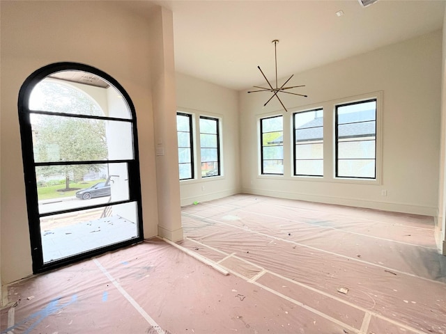 entryway featuring a chandelier