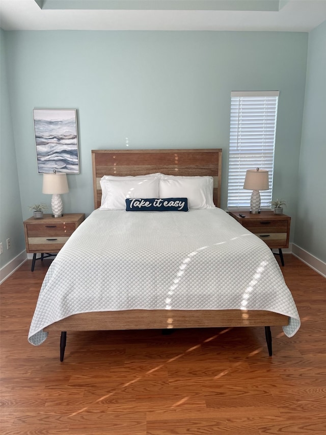 bedroom featuring wood-type flooring