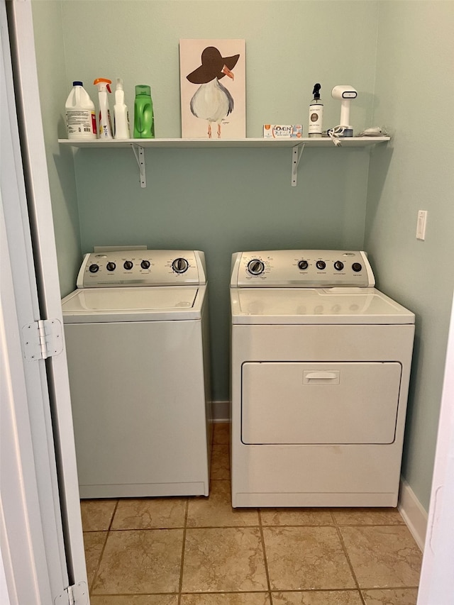 washroom featuring light tile flooring and independent washer and dryer