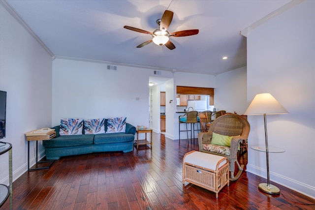 interior space featuring dark hardwood / wood-style flooring, ceiling fan, and crown molding