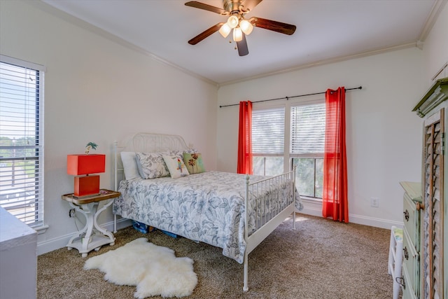 carpeted bedroom featuring multiple windows, crown molding, and ceiling fan