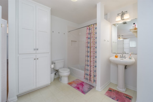 bathroom featuring toilet, tile floors, ceiling fan, and shower / tub combo