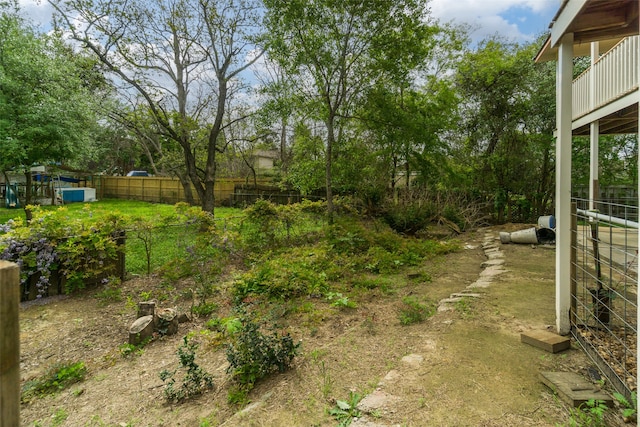 view of yard featuring a balcony