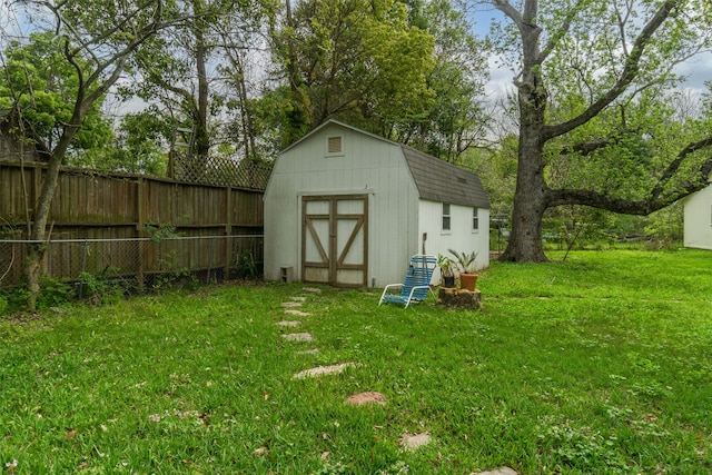 view of outdoor structure with a lawn