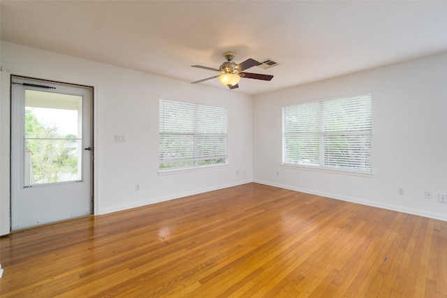 spare room featuring ceiling fan and light wood-type flooring