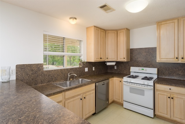 kitchen with light tile flooring, backsplash, dishwasher, sink, and white gas stove