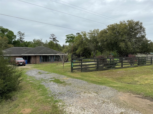 view of yard with a rural view