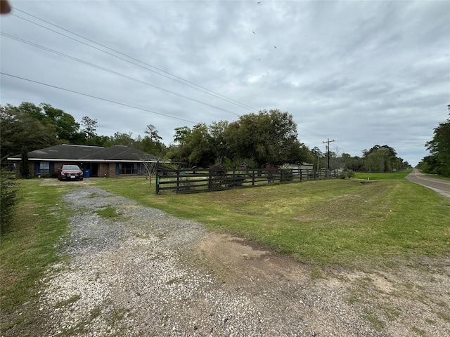 view of road featuring gravel driveway