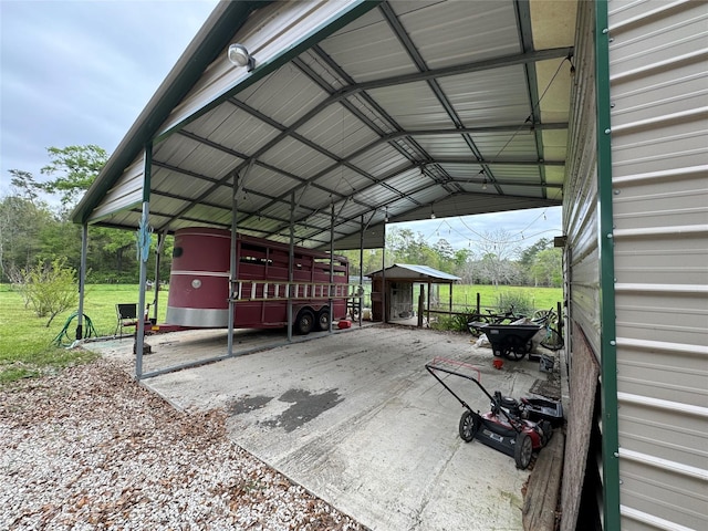 view of car parking featuring driveway and a detached carport