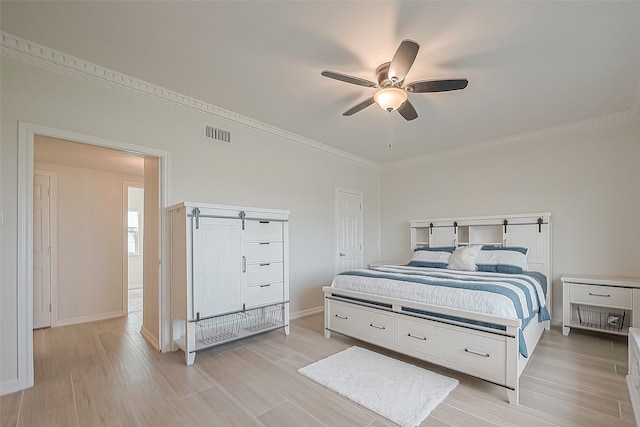 bedroom with ornamental molding, light wood-type flooring, and ceiling fan