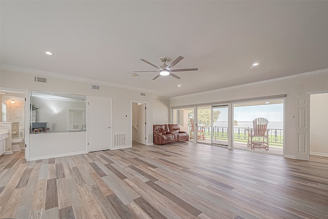 unfurnished room with crown molding, light wood-type flooring, and ceiling fan