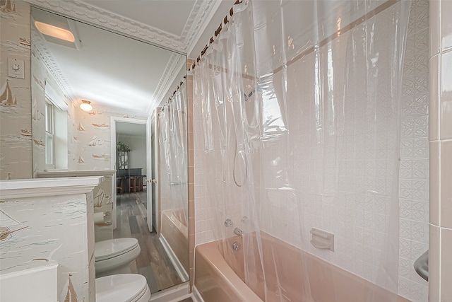 bathroom featuring toilet, crown molding, hardwood / wood-style flooring, and shower / tub combo