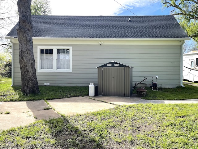 back of house with a patio and a yard