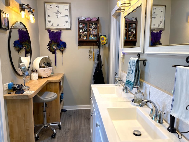 bathroom with hardwood / wood-style flooring and dual bowl vanity