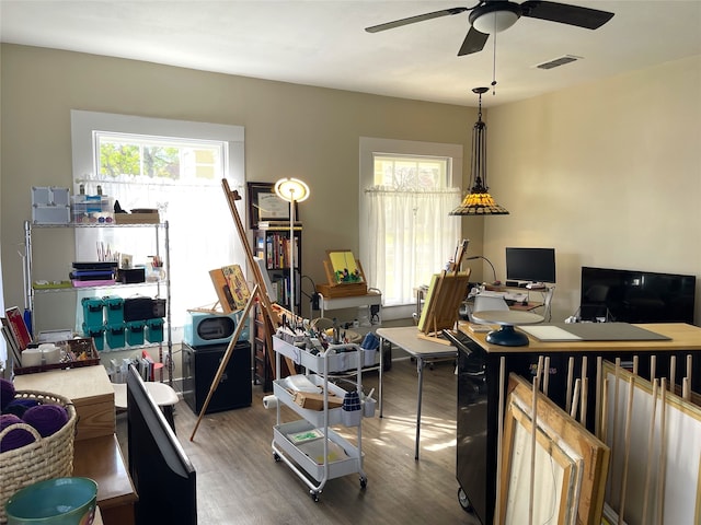 interior space with ceiling fan and dark wood-type flooring