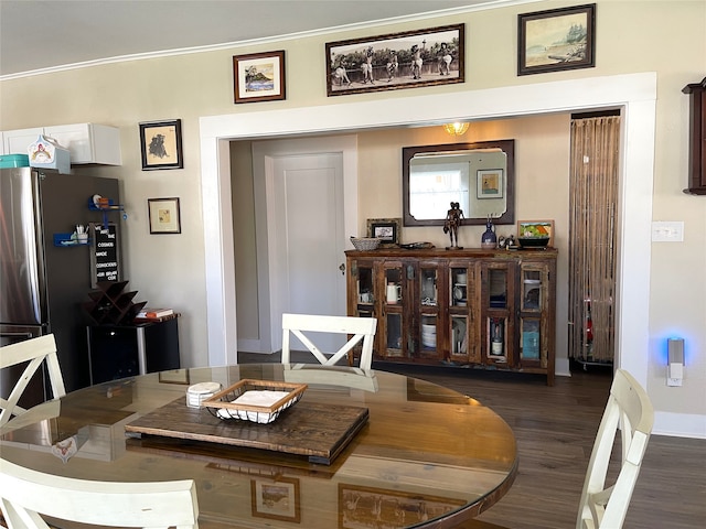 dining room with dark hardwood / wood-style floors