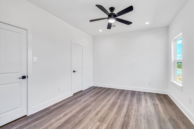 unfurnished room featuring hardwood / wood-style flooring and ceiling fan