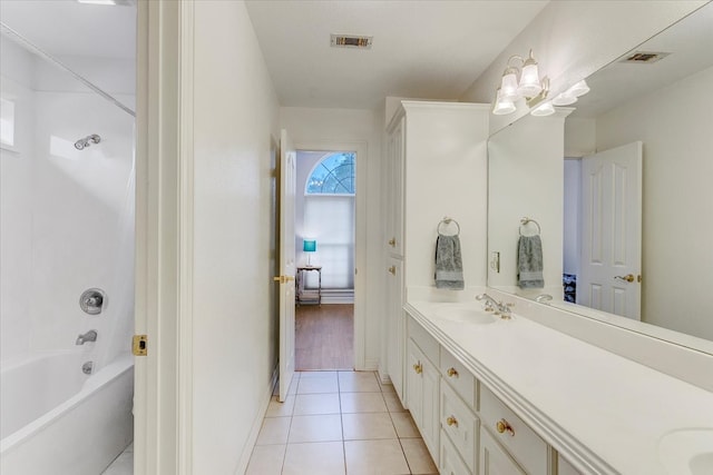 bathroom with shower / bathtub combination, double sink, tile floors, and oversized vanity