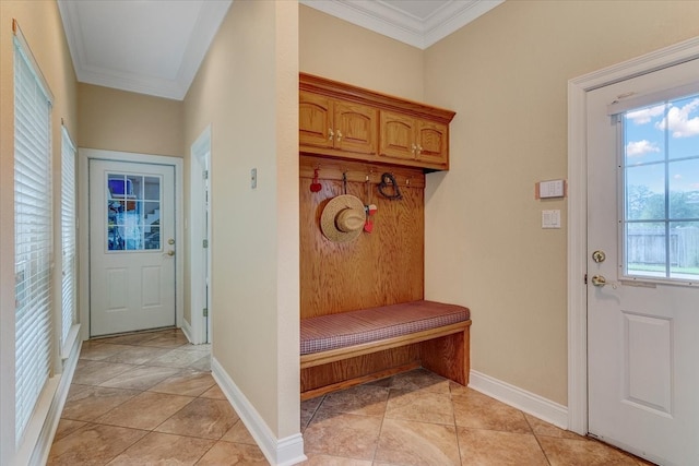 mudroom with ornamental molding and light tile floors