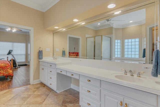 bathroom with ornamental molding, tile floors, ceiling fan, and dual bowl vanity