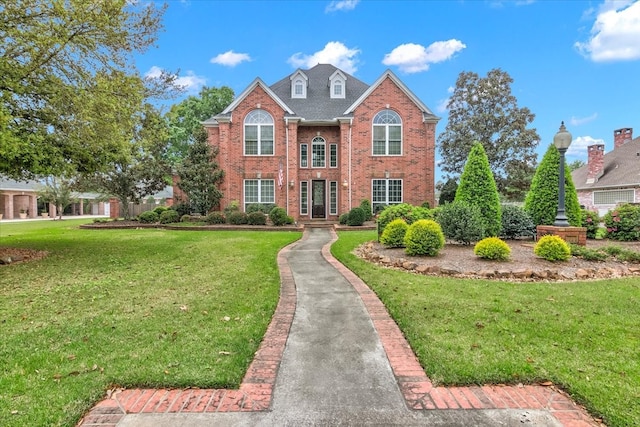 front facade with a front yard