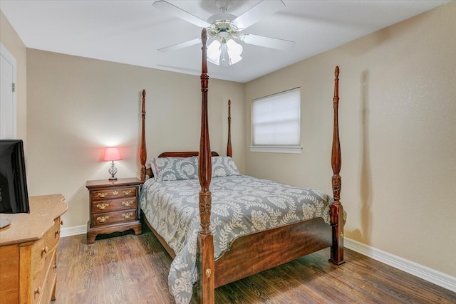 bedroom featuring dark hardwood / wood-style floors and ceiling fan