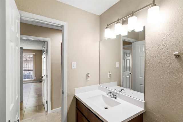 bathroom featuring tile flooring and vanity