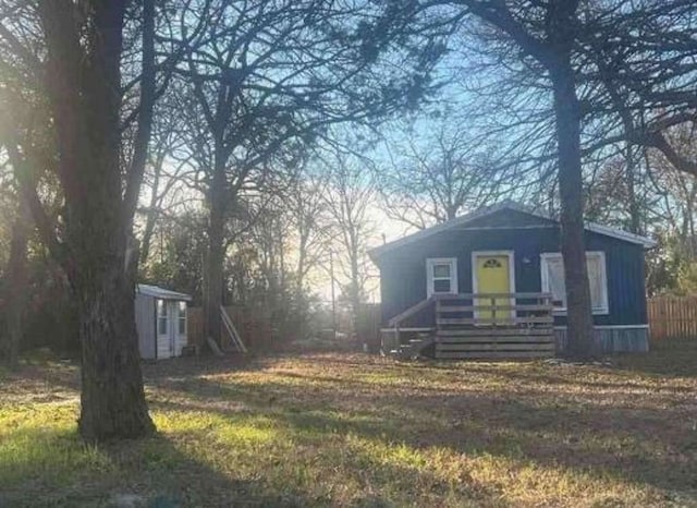 view of side of property with an outdoor structure