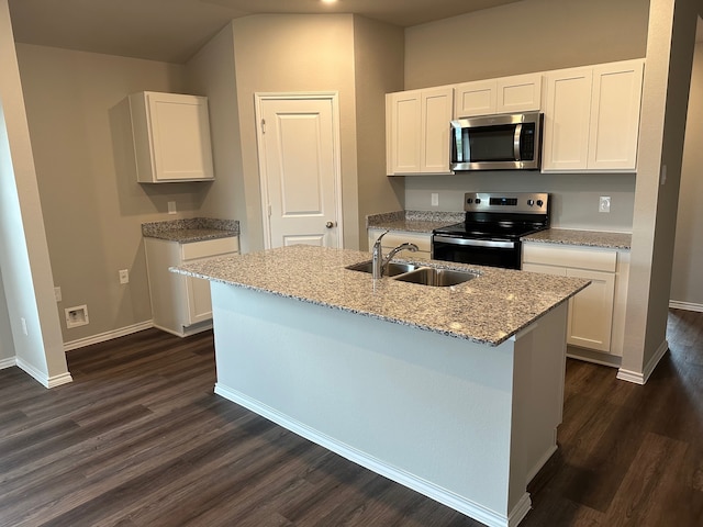 kitchen with white cabinetry, sink, dark hardwood / wood-style flooring, an island with sink, and appliances with stainless steel finishes