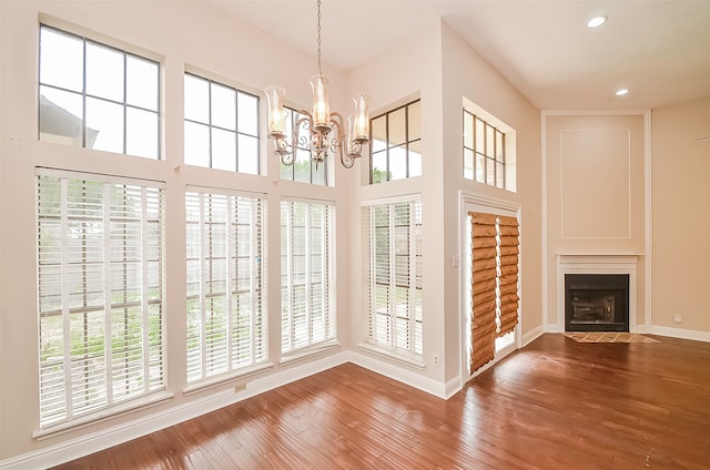 interior space featuring a wealth of natural light and a chandelier