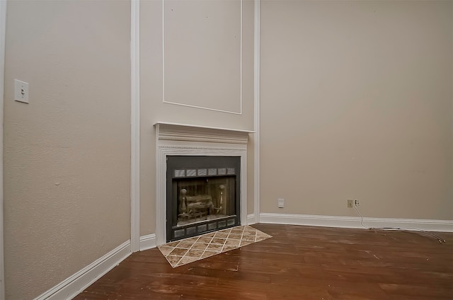 unfurnished living room featuring dark hardwood / wood-style floors