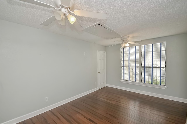 empty room with a textured ceiling, ceiling fan, and dark hardwood / wood-style floors