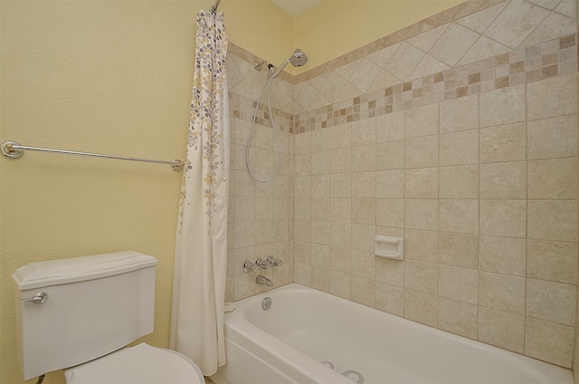 bathroom featuring shower / tub combo with curtain and toilet