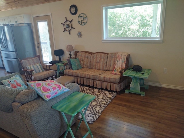 living room with dark hardwood / wood-style flooring