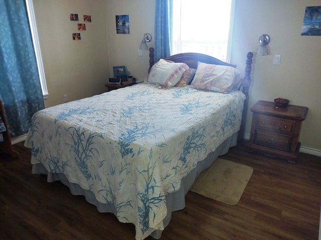 bedroom featuring dark wood-type flooring