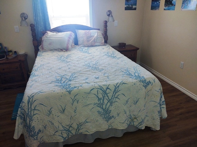 bedroom featuring dark wood-type flooring