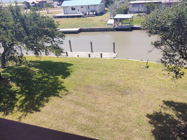 view of yard featuring a boat dock