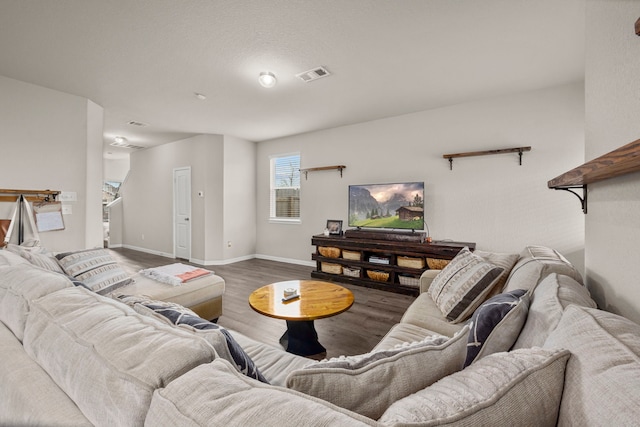 living room with dark hardwood / wood-style flooring