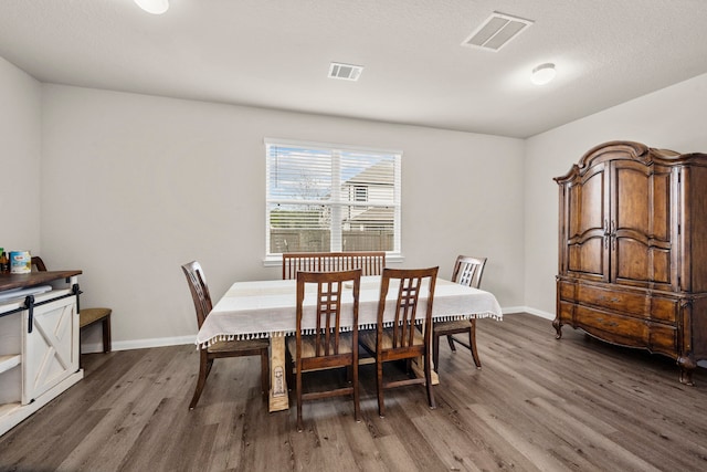 dining area featuring dark hardwood / wood-style floors