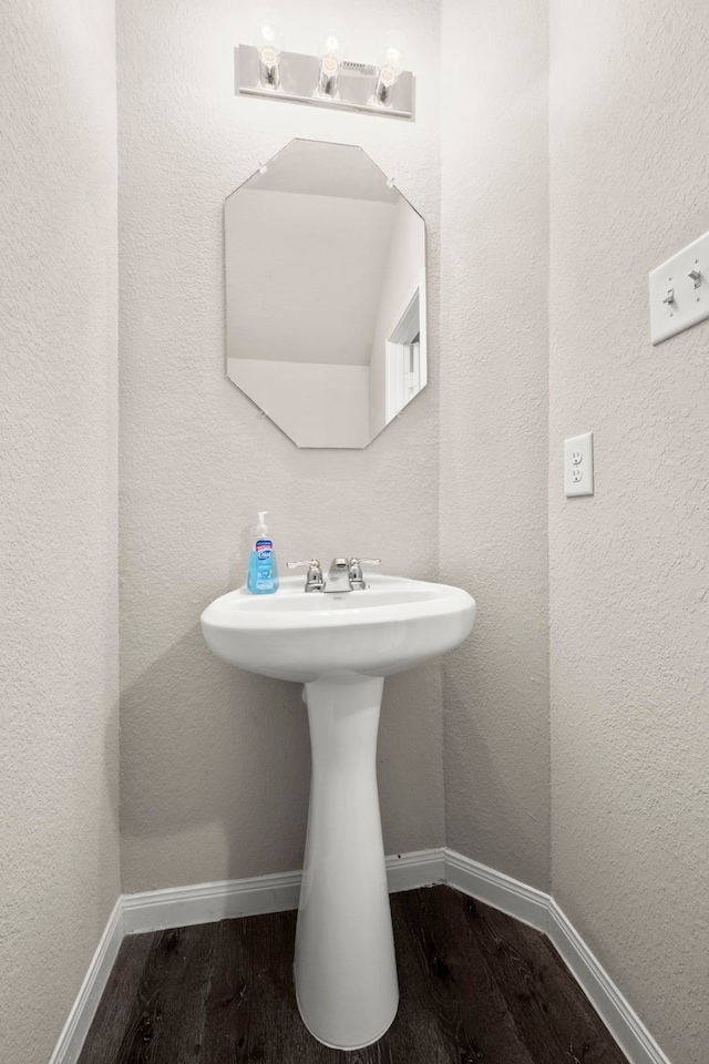 bathroom with wood-type flooring