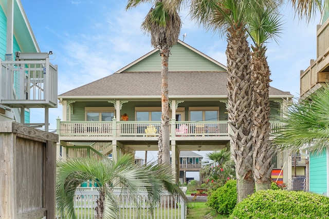 back of property with a balcony