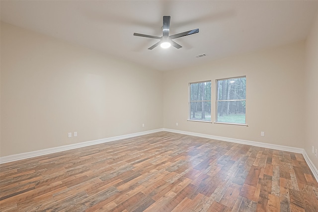 unfurnished room with light wood-type flooring and ceiling fan